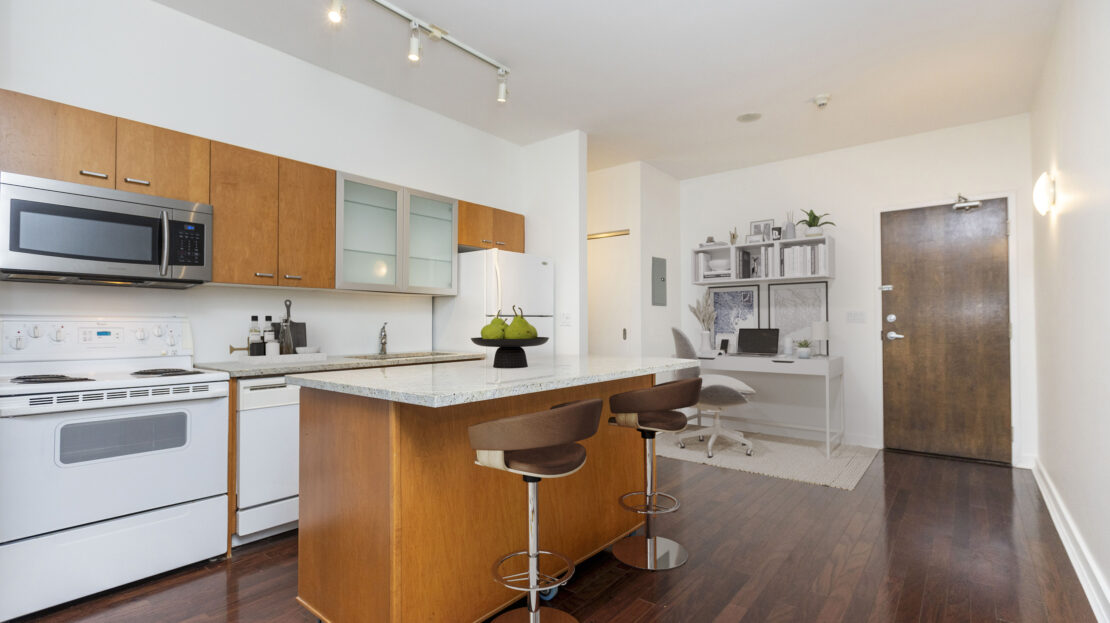 Granite countertop kitchen with moveable island in Ottawa condo