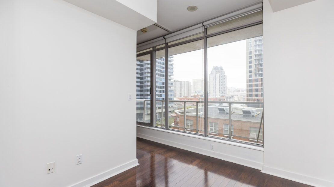 Large bedroom with urban views in condo