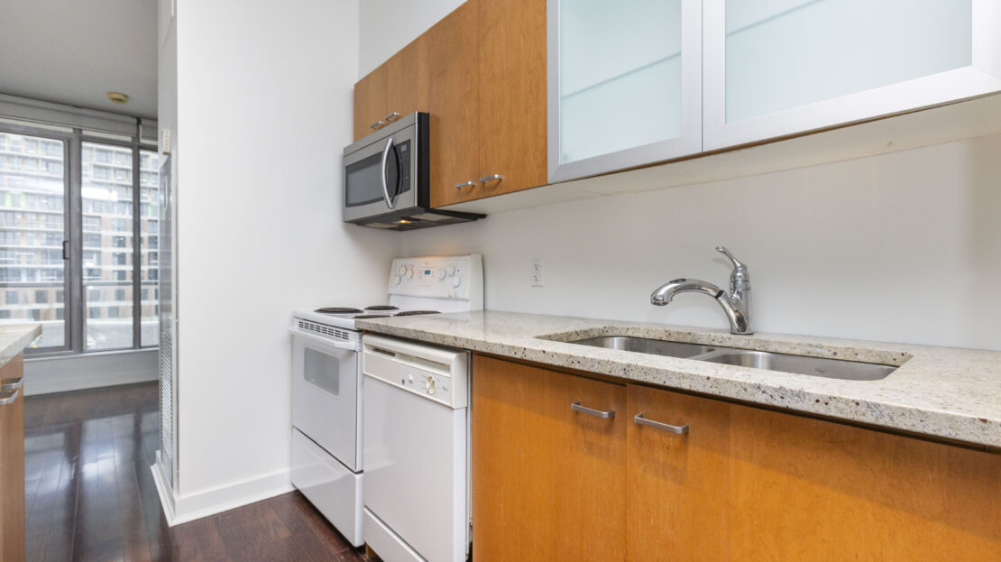 Open kitchen with moveable island in Byward Market condo