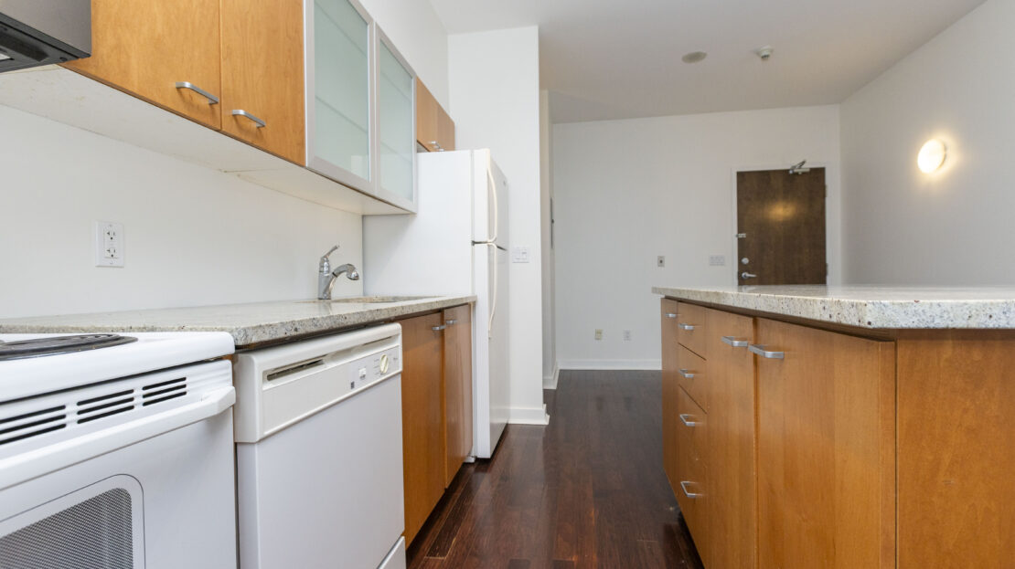 Modern kitchen with granite countertops in Ottawa condo