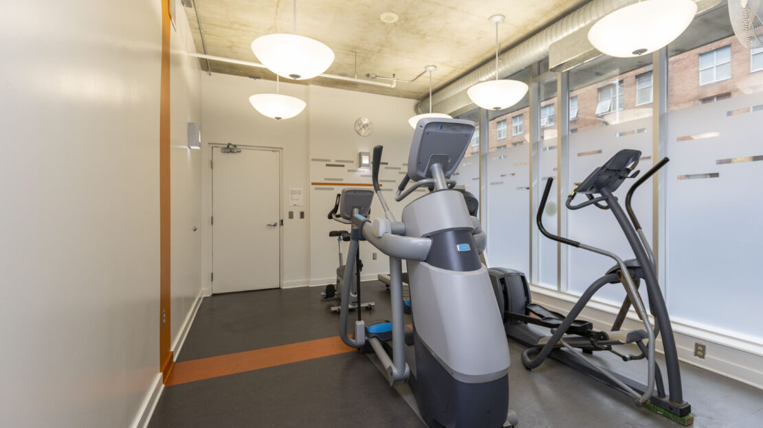 Bright, modern gym with cardio equipment at 383 Cumberland Street condo