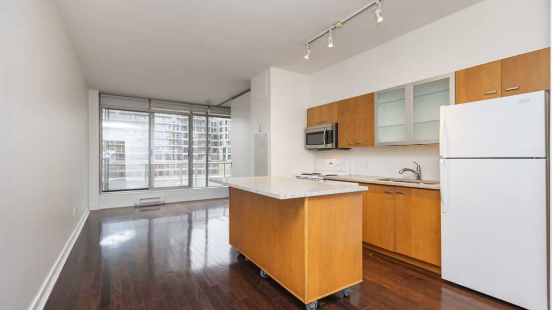 Dining and living area in open-concept Ottawa condo