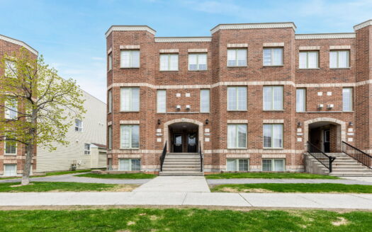 Bright Barrhaven condo living room with fireplace and patio access