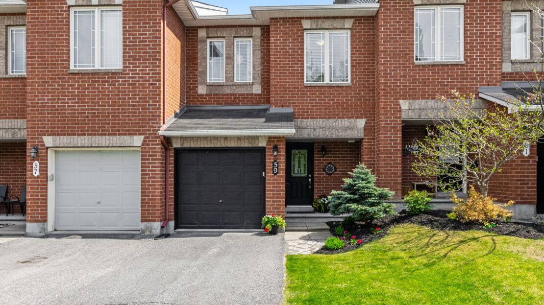 Modern Kanata townhome basement with virtual staging, featuring a cozy fireplace, contemporary furniture, and neutral tones.