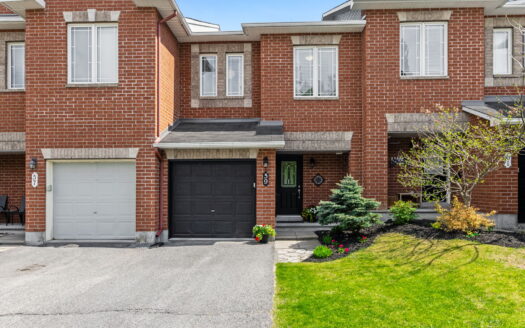 Modern Kanata townhome basement with virtual staging, featuring a cozy fireplace, contemporary furniture, and neutral tones.